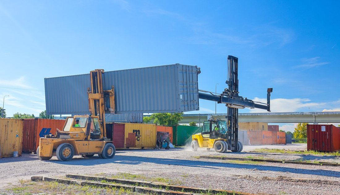 Gray 40-foot shipping container on lift