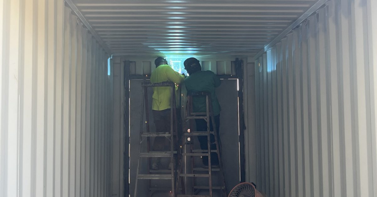 A American welders working on a container modification
