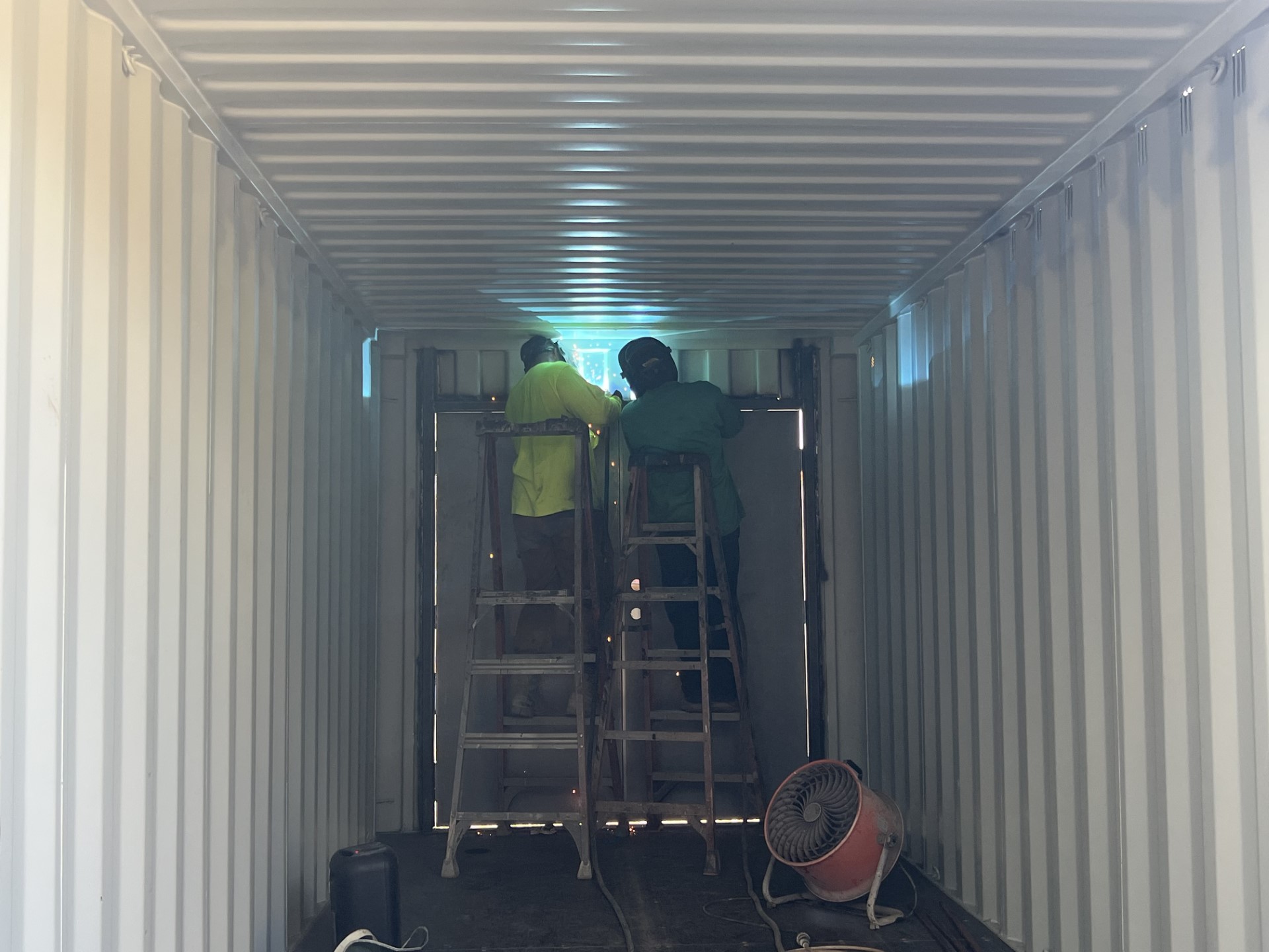 A American welders working on a container modification