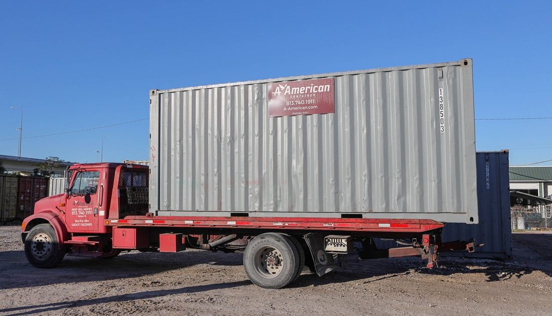 20-foot container on bed of A American delivery truck