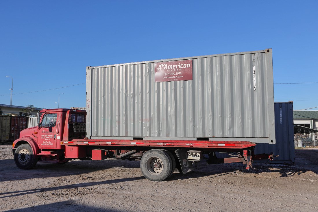 20-foot container on bed of A American delivery truck