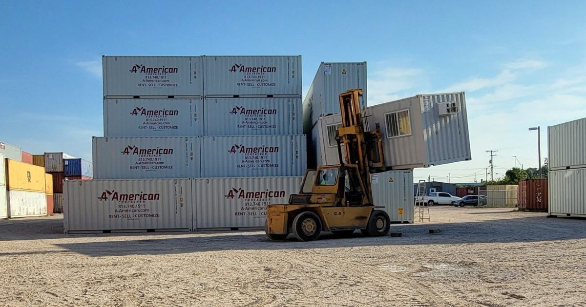 office mod on container lift with rentals behind