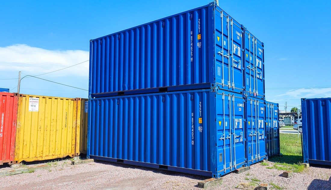 blue 20-foot containers stacked