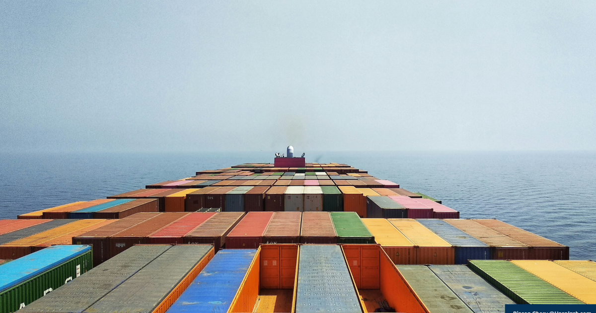 container ship at sea with container stacks