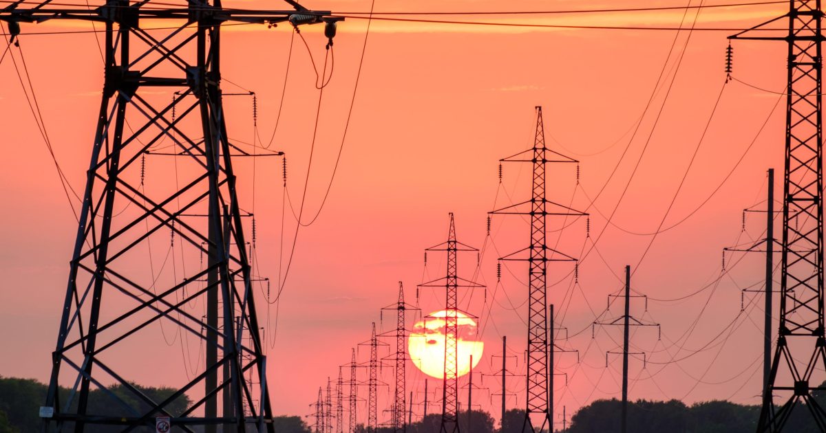 power lines with sun setting in back