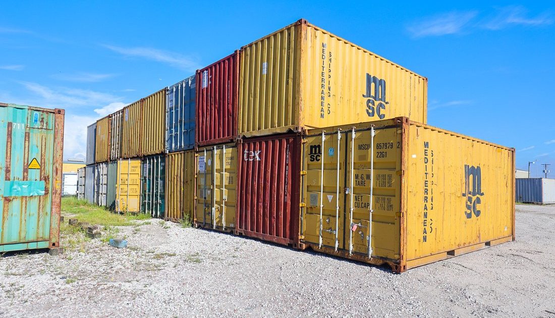 colorful 20-foot containers stacked at A American Container lot Tampa