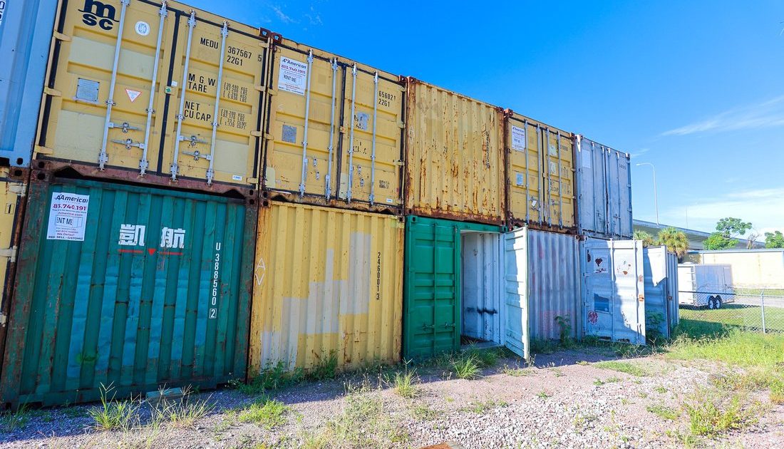stack of shipping containers in various colors at A American Container lot