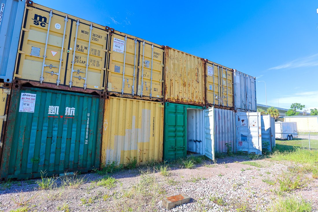 stack of shipping containers in various colors at A American Container lot