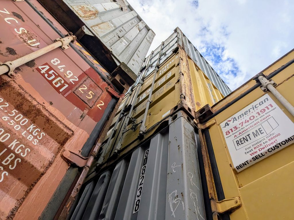 Shipping Containers stacked and ready for rental, purchase, or customization at A American Container